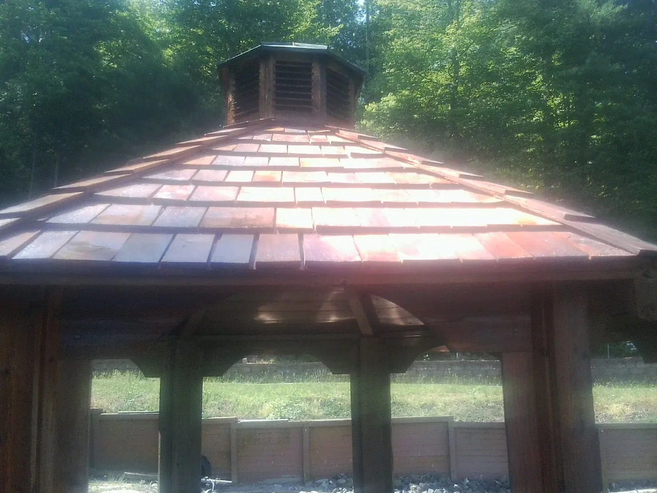New cedar shake roof and cupola on a lakeside gazebo in Valles Mines